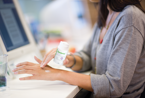 woman using Epaderm in her hands